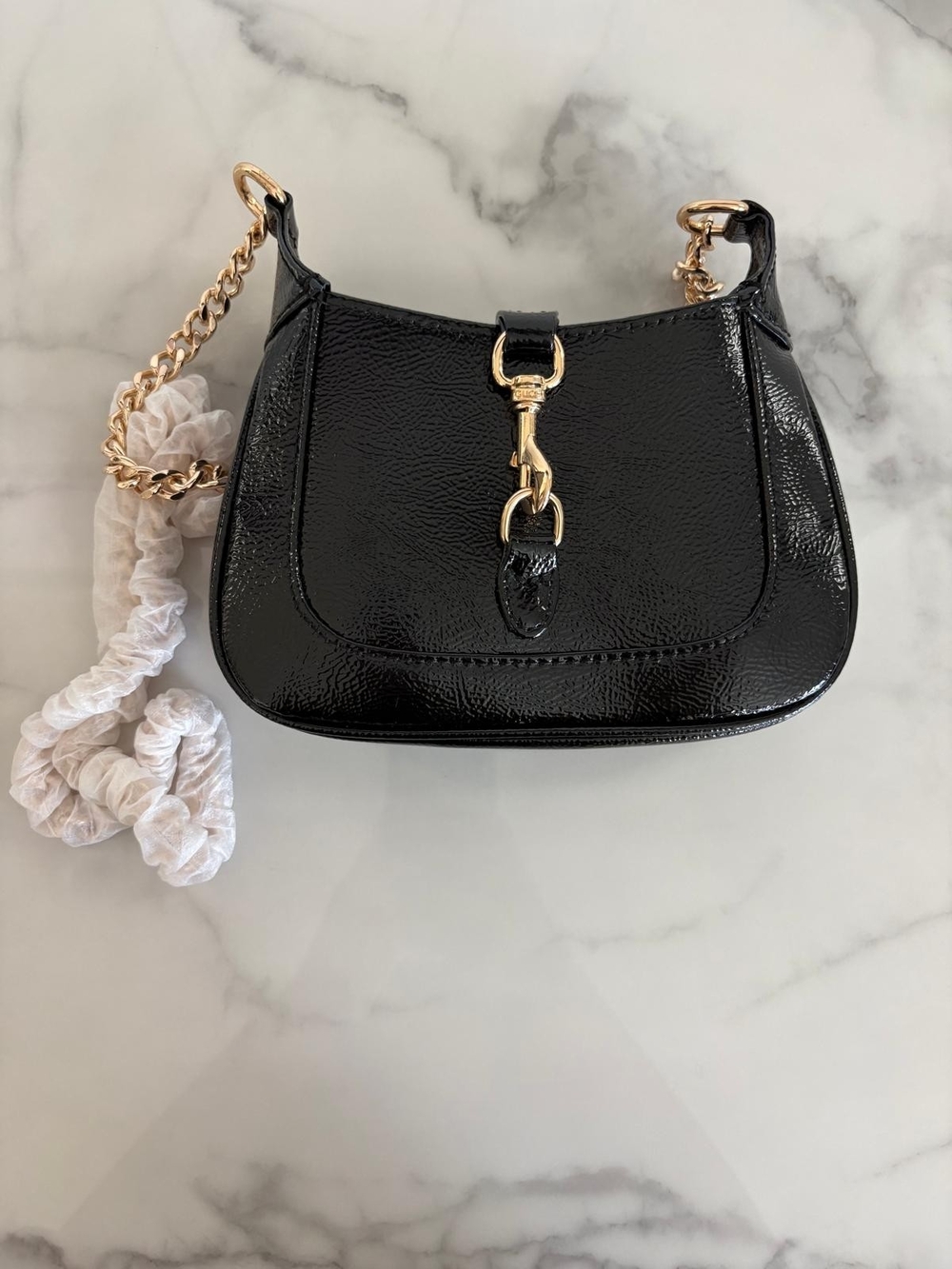 Glossy Black Patent Shoulder Bag with Gold Chain Detail